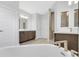 Luxurious bathroom boasts a soaking tub, dual vanities, and a glass-enclosed shower at 2509 N Glenwood Dr, Tampa, FL 33602