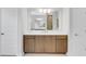 Contemporary bathroom features a large mirror, spacious vanity with modern hardware, and stylish lighting fixtures at 2509 N Glenwood Dr, Tampa, FL 33602