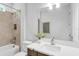 Bright bathroom features modern vanity, stylish fixtures, bathtub, and a decorative plant for a cozy feel at 2509 N Glenwood Dr, Tampa, FL 33602