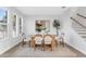 Bright dining room features modern oval wood table and stylish chairs illuminated by natural light at 2509 N Glenwood Dr, Tampa, FL 33602