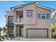Modern two-story home featuring a balcony, gray exterior and a two car garage at 2509 N Glenwood Dr, Tampa, FL 33602