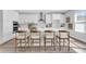 Modern kitchen with white cabinetry, a center island, and hardwood floors at 2509 N Glenwood Dr, Tampa, FL 33602
