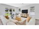 Cozy living room featuring a large couch, stylish decor, and natural light from sliding glass doors at 2509 N Glenwood Dr, Tampa, FL 33602