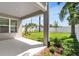Covered patio with a view of the landscaped backyard, offering a serene outdoor living space at 2509 N Glenwood Dr, Tampa, FL 33602