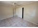 Neutral bedroom featuring tile floor, ceiling fan, closet and neutral walls at 4407 N 41St St, Tampa, FL 33610