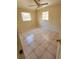 Bright bedroom with tiled floors, neutral walls, and natural light streaming through the windows at 4407 N 41St St, Tampa, FL 33610
