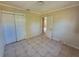 Neutral bedroom featuring tile floor, closet and neutral walls at 4407 N 41St St, Tampa, FL 33610