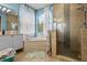 Bathroom with soaking tub and walk-in shower at 3823 65Th E Ave, Sarasota, FL 34243