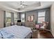 Main bedroom with a dresser and rocking chair at 3823 65Th E Ave, Sarasota, FL 34243