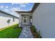 Front entrance with a walkway leading to a blue front door at 9417 Shorebird Ct, Parrish, FL 34219