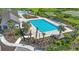 Community lap pool and surrounding landscape at 14292 Swiss Bridge Dr, Riverview, FL 33579