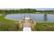 Fishing dock with wooden deck overlooking a lake at 14292 Swiss Bridge Dr, Riverview, FL 33579