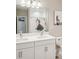 Double vanity bathroom with shower and decorative shower curtain at 14292 Swiss Bridge Dr, Riverview, FL 33579