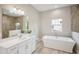 Bathroom with soaking tub, walk-in shower, and modern vanity at 14292 Swiss Bridge Dr, Riverview, FL 33579