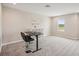 Bright bonus room with window and standing desk at 14292 Swiss Bridge Dr, Riverview, FL 33579
