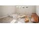 Well-lit Bedroom featuring a crib, toys, and neutral decor at 14292 Swiss Bridge Dr, Riverview, FL 33579