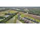 Aerial view of houses, pond, and landscape at 14292 Swiss Bridge Dr, Riverview, FL 33579