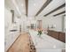 Open concept kitchen with white cabinets, quartz countertops and an island at 14292 Swiss Bridge Dr, Riverview, FL 33579