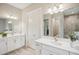 Double vanity bathroom with modern fixtures and large mirror at 14292 Swiss Bridge Dr, Riverview, FL 33579