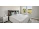 Bedroom with a double bed, nightstand, and ample closet space at 14292 Swiss Bridge Dr, Riverview, FL 33579