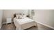 Cozy bedroom with a bed, nightstand, and window at 14292 Swiss Bridge Dr, Riverview, FL 33579