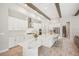 Spacious kitchen with white cabinets, large island, and stainless steel appliances at 14292 Swiss Bridge Dr, Riverview, FL 33579