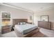 Main bedroom with a large bed, nightstands, and dresser at 14292 Swiss Bridge Dr, Riverview, FL 33579