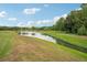 Serene landscape view with a tranquil waterway and lush greenery at 14292 Swiss Bridge Dr, Riverview, FL 33579