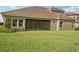 House with a large backyard and screened-in patio at 14292 Swiss Bridge Dr, Riverview, FL 33579
