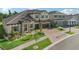 Two-story home with stone accents and landscaped yard at 14292 Swiss Bridge Dr, Riverview, FL 33579