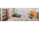 Home office features a standing desk, treadmill, and ample shelving at 14292 Swiss Bridge Dr, Riverview, FL 33579