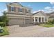 Two-story house with a large driveway and landscaping at 14292 Swiss Bridge Dr, Riverview, FL 33579
