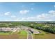 Aerial view of community with lake and homes at 14292 Swiss Bridge Dr, Riverview, FL 33579