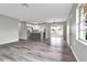 Open concept living space with hardwood floors and an updated kitchen at 2220 Grenadier Dr # 2220, Sun City Center, FL 33573