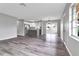 Spacious living area with wood-look flooring and an open floor plan at 2220 Grenadier Dr # 2220, Sun City Center, FL 33573