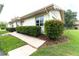 Well-maintained house with landscaped walkway and manicured hedges at 2220 Grenadier Dr # 2220, Sun City Center, FL 33573
