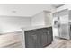 Gray kitchen island with granite countertop and stainless steel appliances at 2220 Grenadier Dr # 2220, Sun City Center, FL 33573