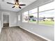 Sunroom featuring large windows and ceiling fan at 2220 Grenadier Dr # 2220, Sun City Center, FL 33573
