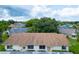 Aerial view showcasing a house with brown roof and landscaped yard at 2220 Grenadier Dr # 2220, Sun City Center, FL 33573