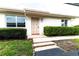 Updated condo exterior with manicured hedges and a welcoming entrance at 2220 Grenadier Dr # 2220, Sun City Center, FL 33573