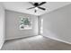 Spacious bedroom with ceiling fan and window at 2220 Grenadier Dr # 2220, Sun City Center, FL 33573
