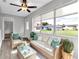 Sunroom with wicker furniture and view of backyard at 2220 Grenadier Dr # 2220, Sun City Center, FL 33573