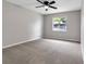 Simple bedroom with window and ceiling fan at 2220 Grenadier Dr # 2220, Sun City Center, FL 33573