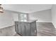 Kitchen island with granite countertop and gray cabinetry at 2220 Grenadier Dr # 2220, Sun City Center, FL 33573