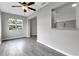 Dining area with wood-look floors and kitchen passthrough at 2220 Grenadier Dr # 2220, Sun City Center, FL 33573