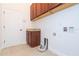 Laundry room with cabinets and hookups for washer/dryer at 6948 Silver Sage Cir, Tampa, FL 33634