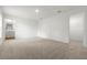 Large bedroom with plush carpeting and an ensuite bathroom at 5093 Burnside St, North Port, FL 34291