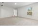 Spacious bedroom with neutral carpeting and a window with blinds at 5093 Burnside St, North Port, FL 34291