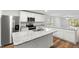 Island kitchen with stainless steel appliances and granite counters at 5093 Burnside St, North Port, FL 34291