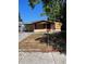 Fixer-upper home with boarded windows and chain-link fence at 10007 N 26Th St, Tampa, FL 33612